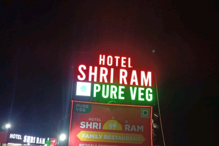 Open Dot LED Sign Boards (e.g., Open Dot LED Sign mounted on Hotel)